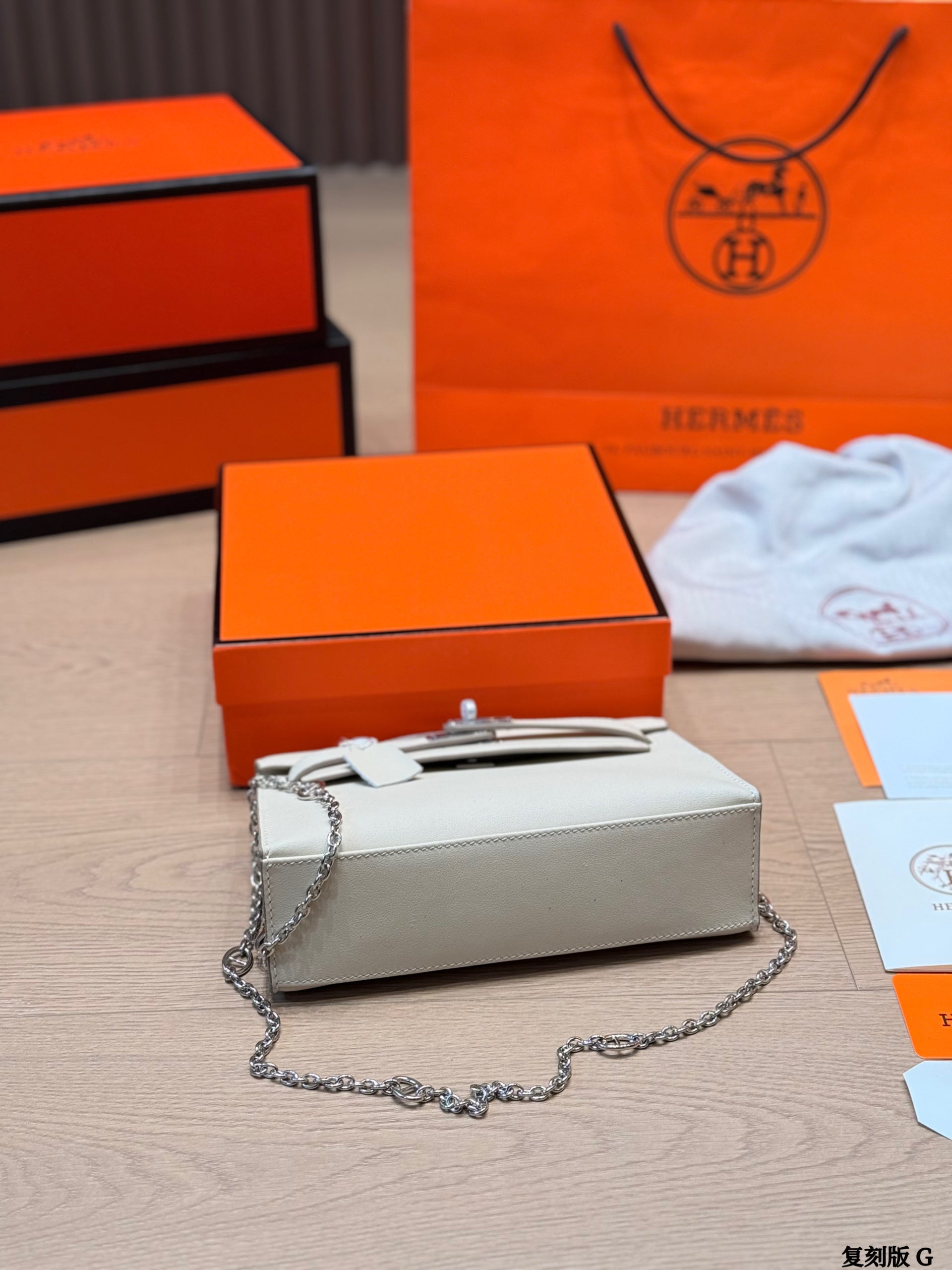 Classic Kelly clutch with silver buckle, upgraded with Swift leather.