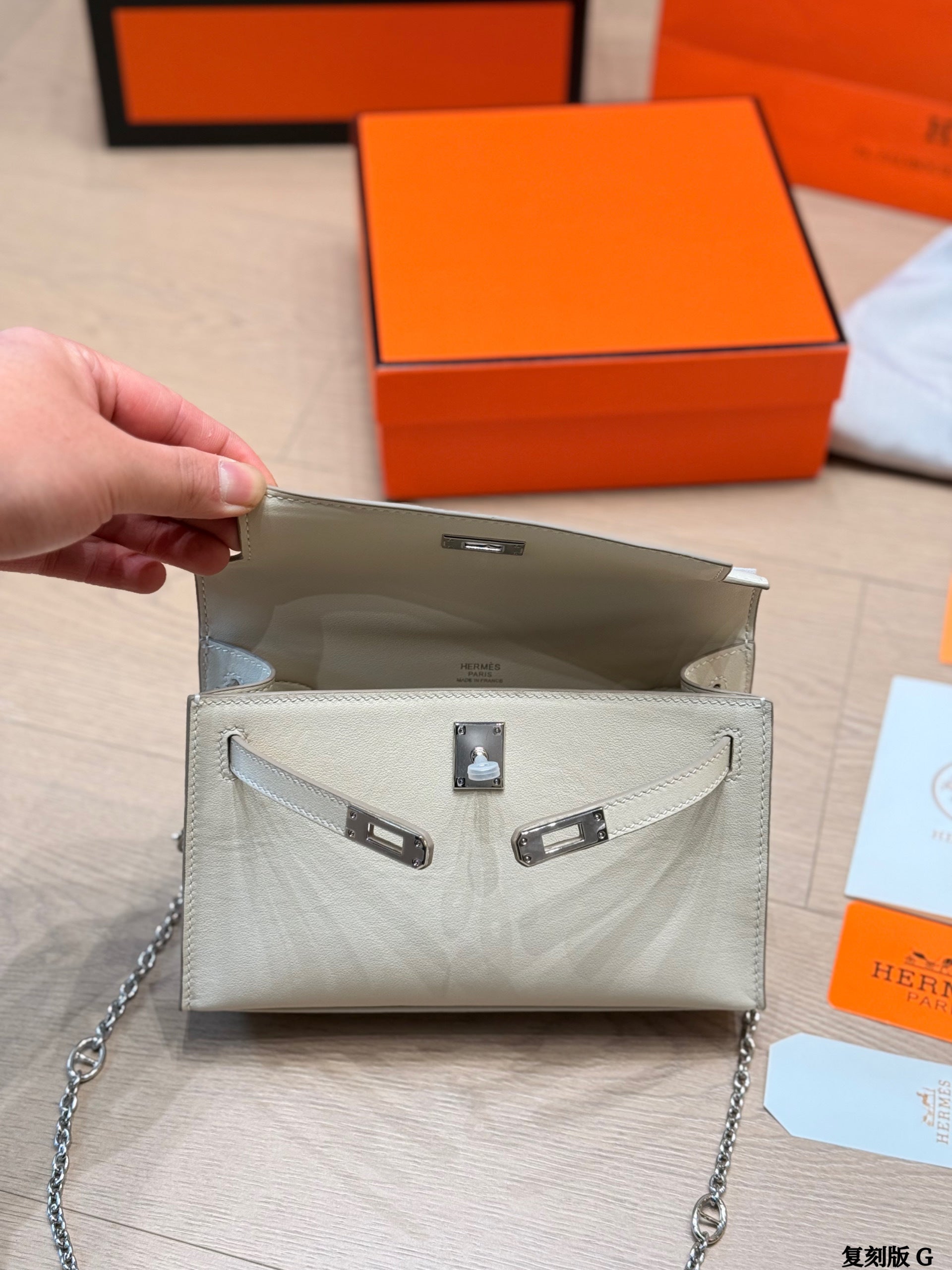 Classic Kelly clutch with silver buckle, upgraded with Swift leather.