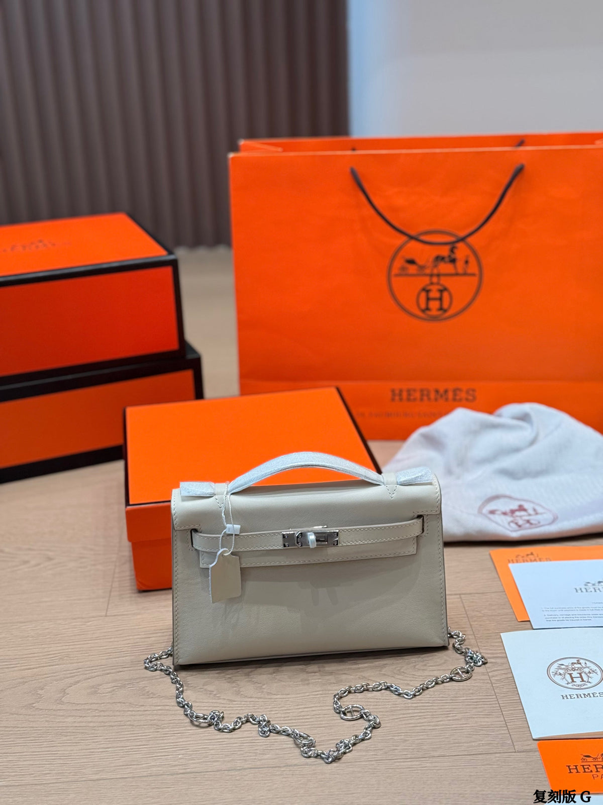 Classic Kelly clutch with silver buckle, upgraded with Swift leather.