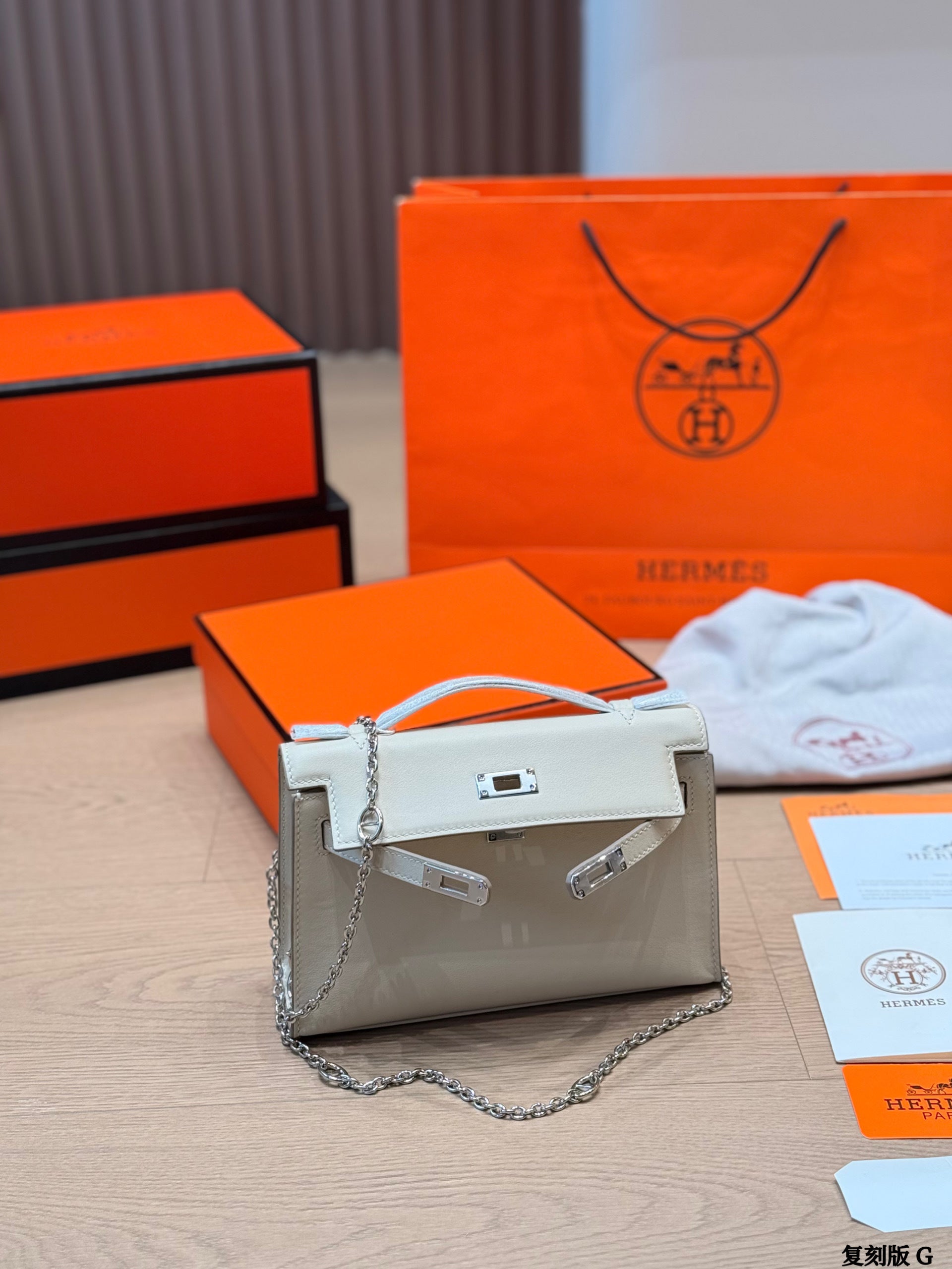 Classic Kelly clutch with silver buckle, upgraded with Swift leather.