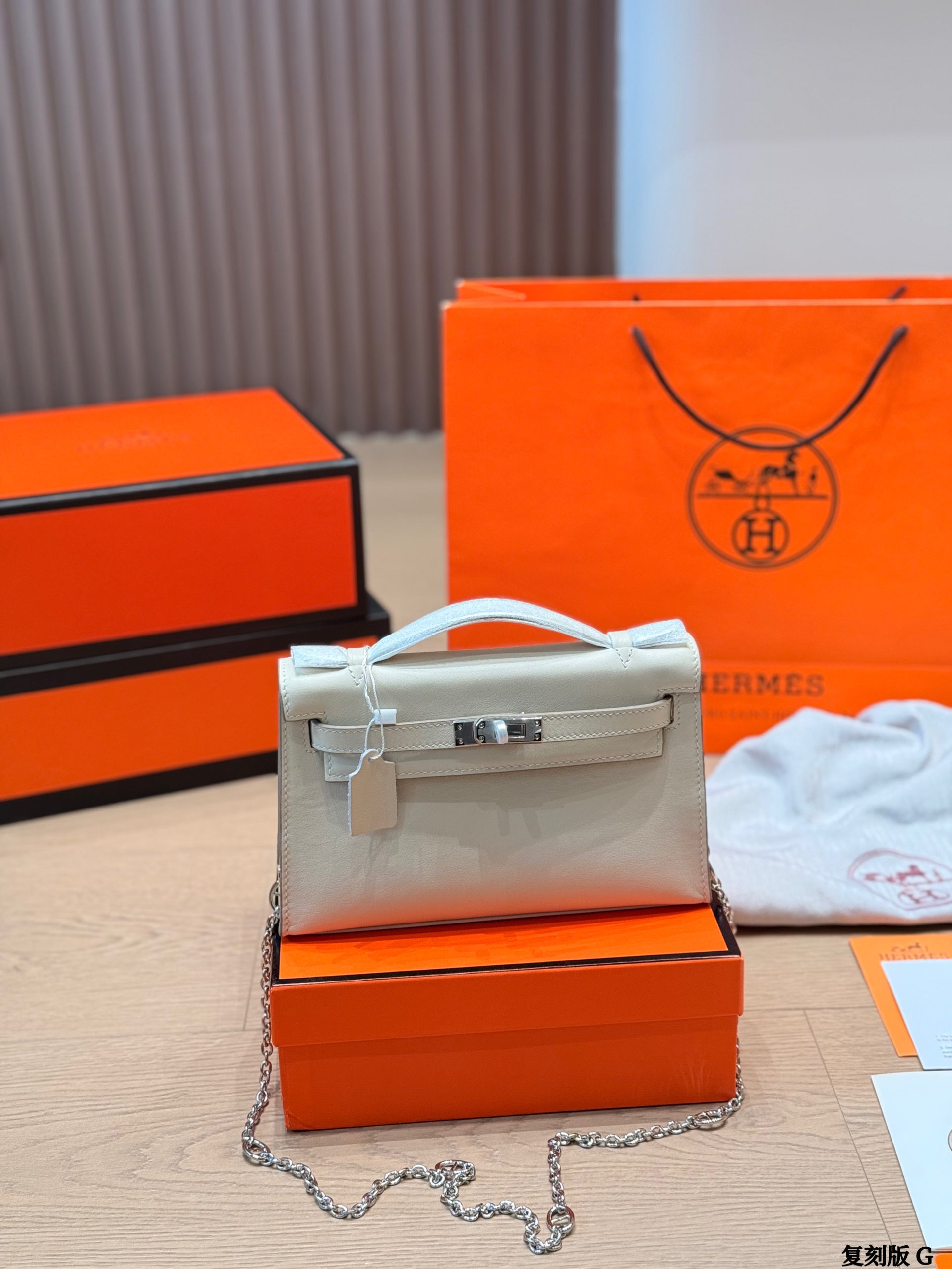 Classic Kelly clutch with silver buckle, upgraded with Swift leather.