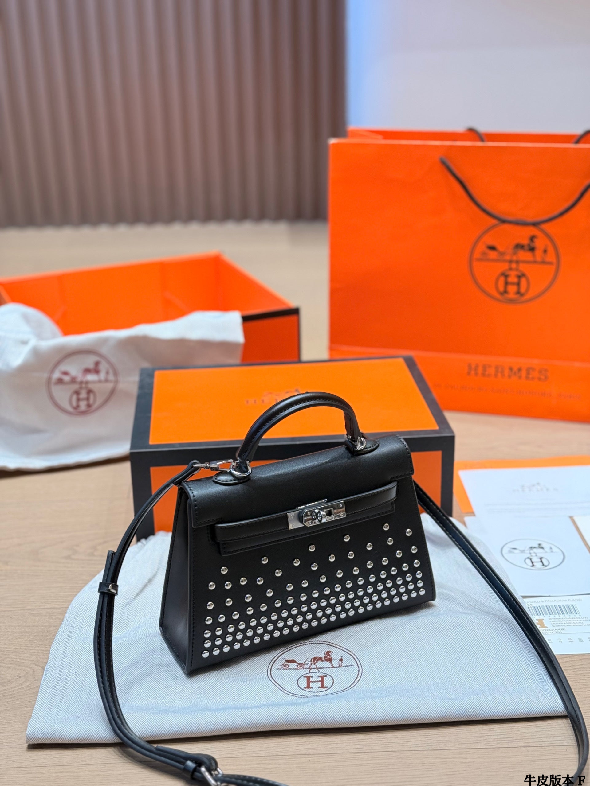 Leather version, Hermès Kelly Mini II studded bag